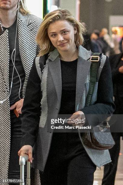 Actress Chloe Moretz is seen at Charles-de-Gaulle airport on September 29, 2019 in Paris, France.