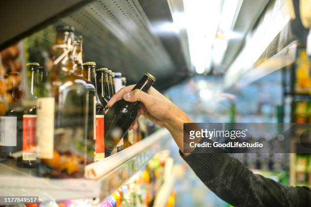 buying beer - drink stock pictures, royalty-free photos & images