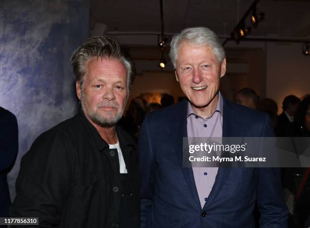 Musician/artist John Mellencamp poses with former U.S. President Bill Clinton at the Private Preview of Mellencamp's art exhibition "Binding Wires:...