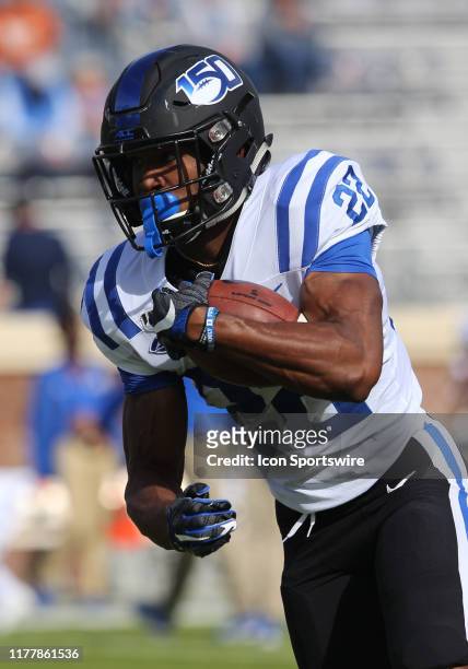 Duke running back Jaylen Coleman rushes up field during pregame drills prior to the game between the Duke Blue Devils and the Virginia Cavaliers on...