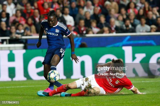 Bertrand Traore of Lyon vies for the ball with Ferro of Benfica during UEFA Champions League Group G football match SL Benfica against Olympique...