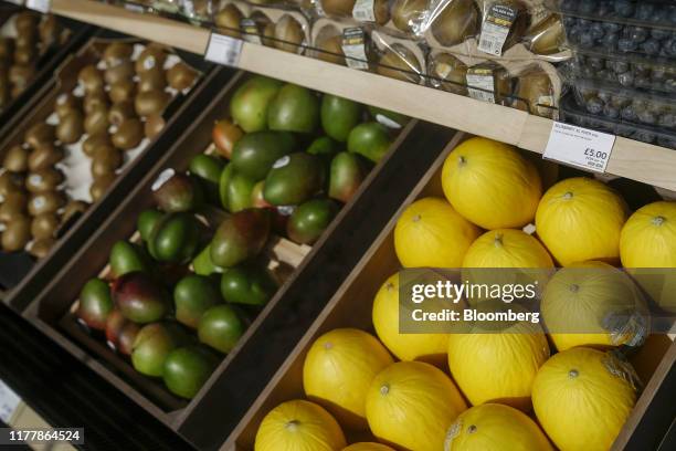 Kiwis, mangoes and melons sit for sale from at Marks and Spencer Group Plc's newly opened store in Fraddon, U.K. On Wednesday, Oct. 23, 2019. Marks &...