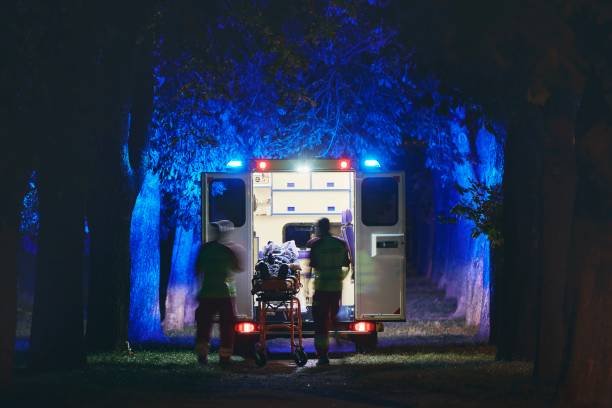 team of emergency medical service - ambulance night stock pictures