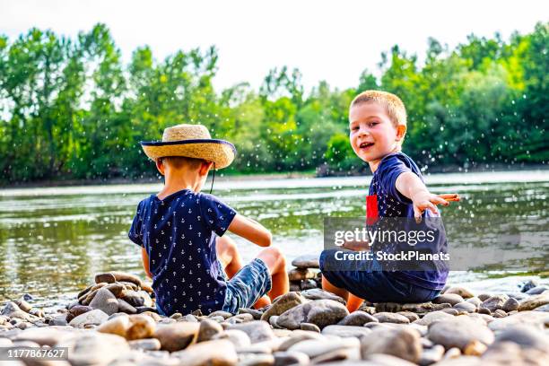 Kids Throwing Stones Photos and Premium High Res Pictures - Getty Images