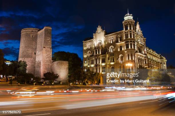 the maiden tower at night, baku, azerbaijan - baku stock pictures, royalty-free photos & images
