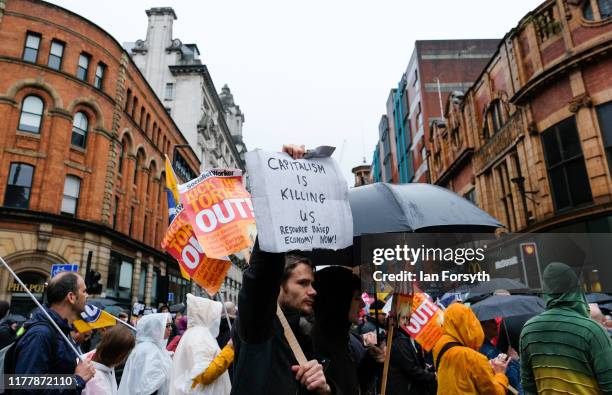 Protesters take part in a large scale demonstration against austerity and the Conservative government on September 29, 2019 in Manchester, England....