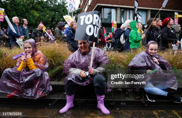 Protesters take part in a large scale demonstration against austerity and the Conservative government on September 29, 2019 in Manchester, England....