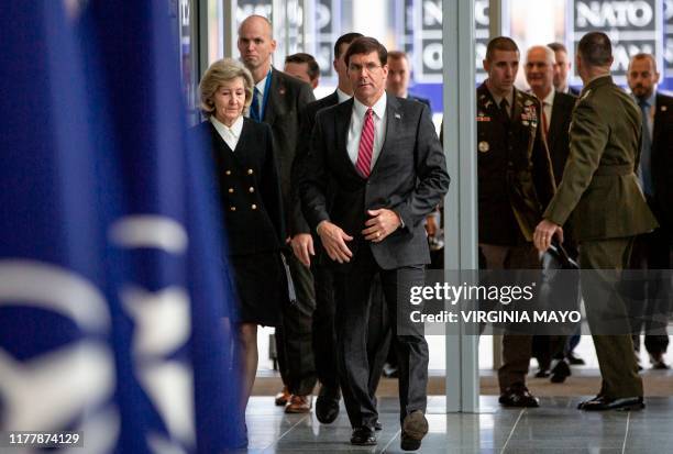 Secretary for Defense Mark Esper and US Ambassador to NATO Kay Bailey Hutchison arrive for a meeting of NATO defense ministers at NATO headquarters...