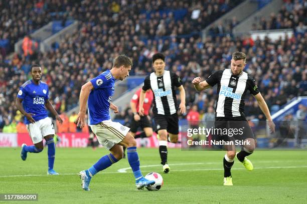 Dennis Praet of Leicester City shoots which deflects of Paul Dummett of Newcastle United for Leicester City's third goal during the Premier League...