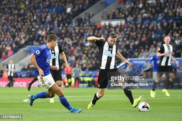 Dennis Praet of Leicester City shoots which deflects of Paul Dummett of Newcastle United for Leicester City's third goal during the Premier League...