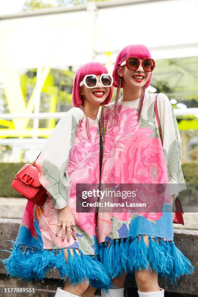 Ami Suzuki and Aya Suzuki of Amiaya wearing Valentino dress and bag outside Valentino during Paris Fashion Week Womenswear Spring Summer 2020 on...