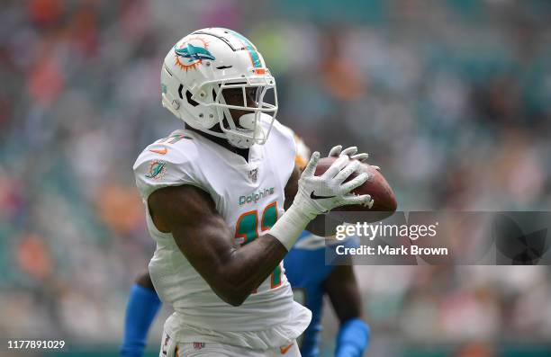 DeVante Parker of the Miami Dolphins catches a touchdown in the first quarter against the Los Angeles Chargers at Hard Rock Stadium on September 29,...