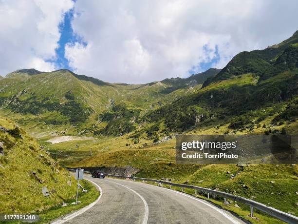 on the road in mauntains - alps romania stock pictures, royalty-free photos & images