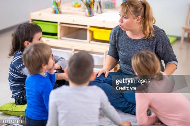 teacher telling a story - narrating stock pictures, royalty-free photos & images