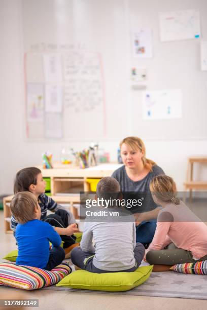 children listening to a fairy tale - narrating stock pictures, royalty-free photos & images