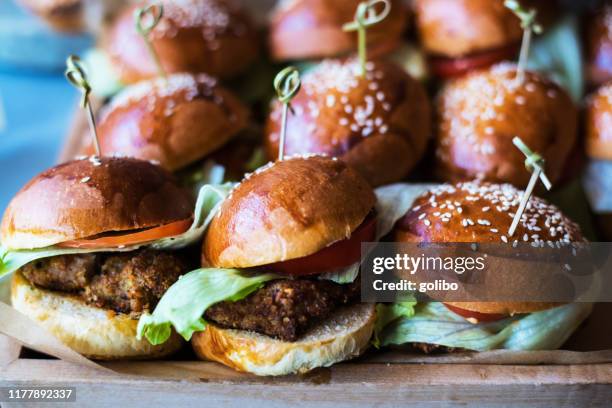 a selection of burgers in a small delicatessen - pattie sellers stock pictures, royalty-free photos & images