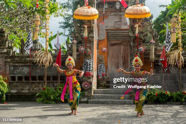 Women dancers during the Barong and Kris dance, which tells a battle between good and evil spirit, performed in Batubulan, Bali Indonesia.