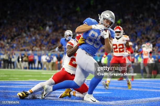 Hockenson of the Detroit Lions scores a touchdown against Bashaud Breeland of the Kansas City Chiefs in the first quarter of the game at Ford Field...