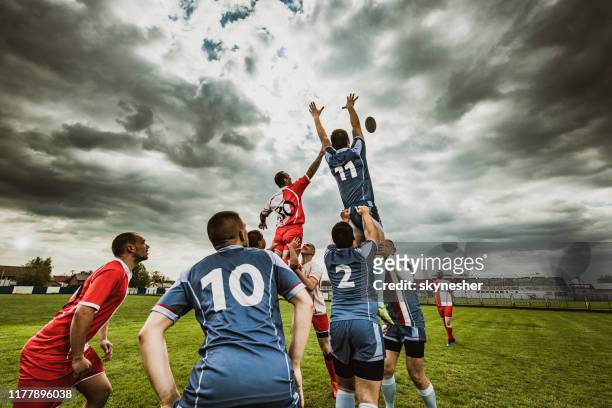 teamwork in rugby match! - rugby union stock pictures, royalty-free photos & images