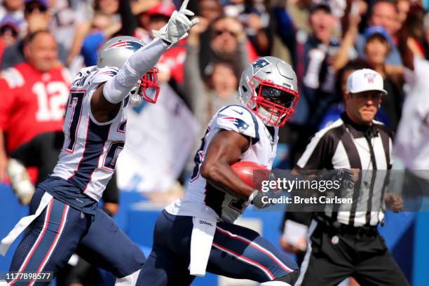 Matthew Slater of the New England Patriots reacts after recovering a blocked punt to score a touchdown against the Buffalo Bills during the first...