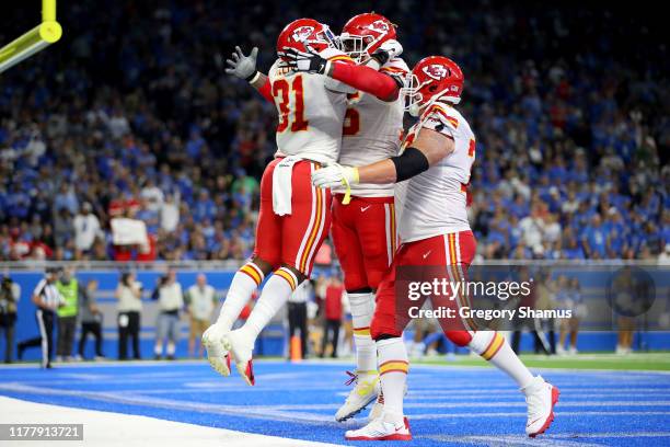 Darrel Williams of the Kansas City Chiefs celebrates with his teammates after scoring a 1 yard touchdown against the Detroit Lions during the fourth...