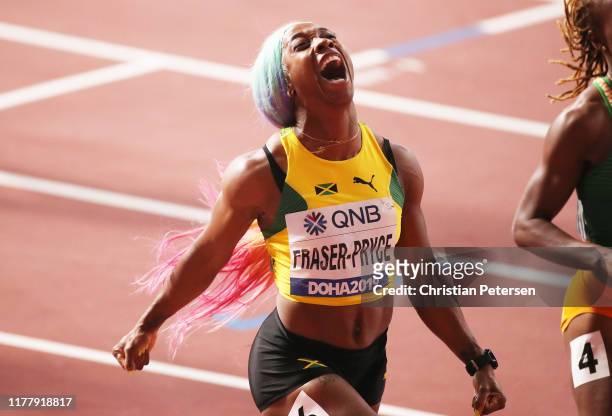 Shelly-Ann Fraser-Pryce of Jamaica celebrates winning the Women's 100 Metres final during day three of 17th IAAF World Athletics Championships Doha...