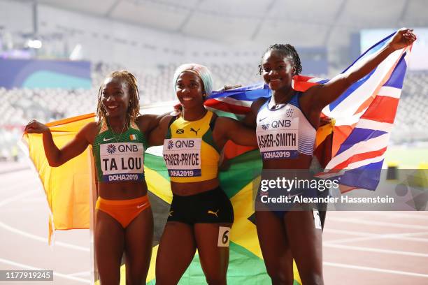 Shelly-Ann Fraser-Pryce of Jamaica, gold, Dina Asher-Smith of Great Britain, silver, and Marie-Josée Ta Lou of the Ivory Coast, bronze, celebrate...