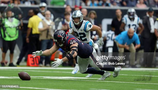 Watt of the Houston Texans recovers a fumble by Kyle Allen of the Carolina Panthers as Christian McCaffrey looks on during the second half at NRG...