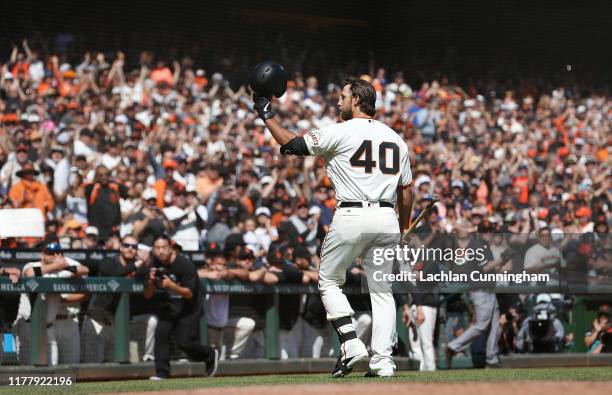 Pinch hitter Madison Bumgarner of the San Francisco Giants acknowledges the fans after batting in the bottom of the fifth inning against the Los...