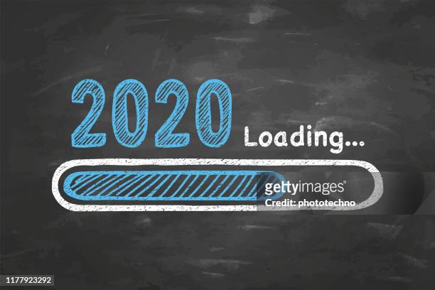 loading new year 2020 on chalkboard background - 2020 stock illustrations