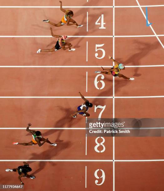 Shelly-Ann Fraser-Pryce of Jamaica, gold, Dina Asher-Smith of Great Britain, silver, and Marie-Josée Ta Lou of the Ivory Coast, bronze, cross the...