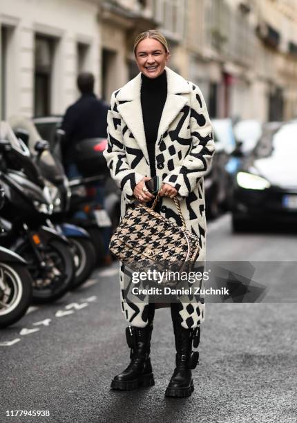 Nina Suess is seen wearing a Thom Browne black and white coat outside the Thom Browne show during Paris Fashion Week SS20 on September 29, 2019 in...