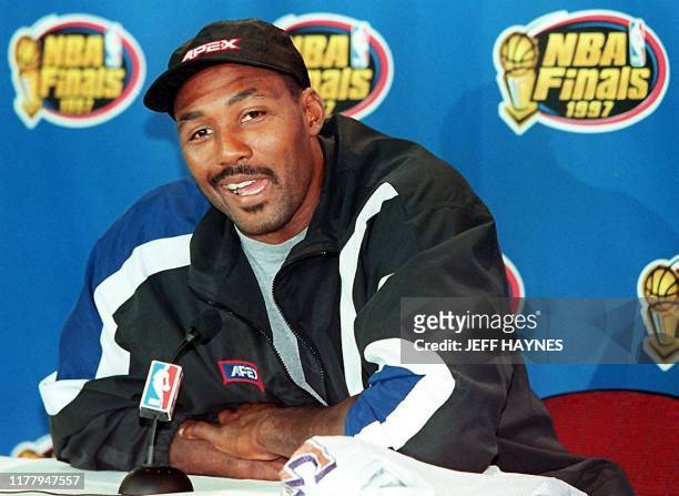 Karl Malone of the Utah Jazz talks to reporters 02 June during a press conference before his morning workout at the United Center in Chicago...