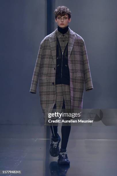 Model walks the runway during the Tmall Cool China Womenswear Spring/Summer 2020 show as part of Paris Fashion Week on September 29, 2019 in Paris,...