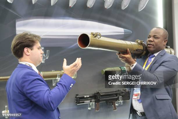 Visitor examines a Russian made rocket-propelled grenade launcher RPG-29 during the Russia-Africa Economic Forum Exhibition on the sidelines of the...