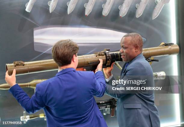 Visitor examines a Russian made rocket-propelled grenade launcher RPG-29 during the Russia-Africa Economic Forum Exhibition on the sidelines of the...