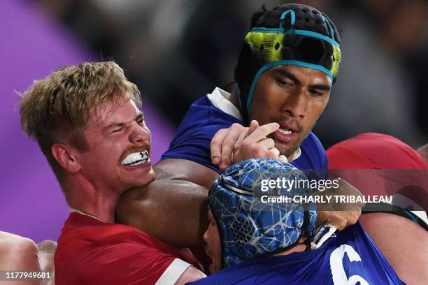 France's lock Sebastien Vahaamahina elbows Wales' flanker Aaron Wainwright during the Japan 2019 Rugby World Cup quarter-final match between Wales...