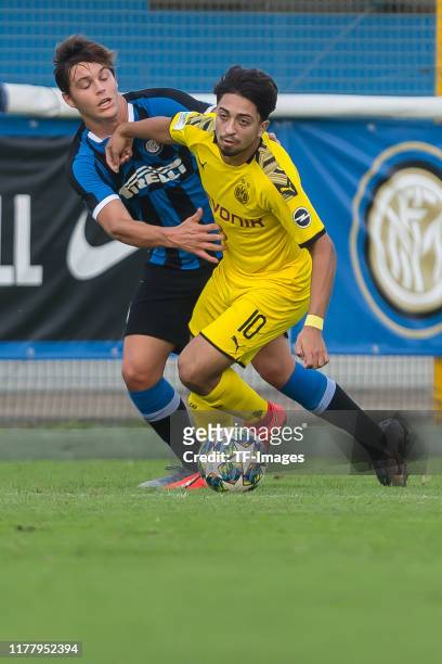 Matias Fonseca of Inter Mailand U19 and Immanuel Pherai of Borussia Dortmund U19 battle for the ball during the UEFA Youth League match between Inter...