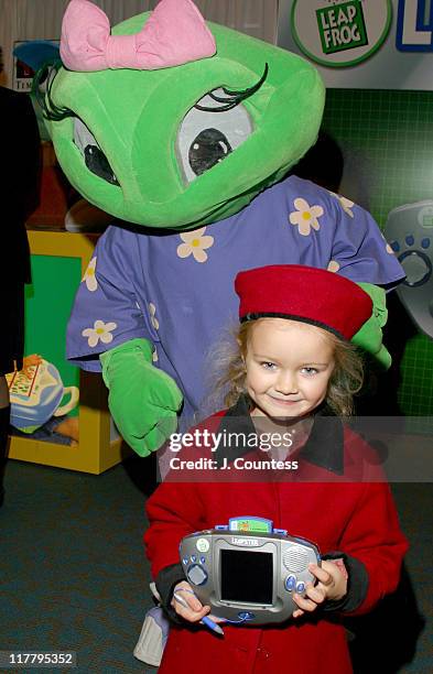 Eulala Harden and "Lily" display the Leapster Multimedia Learning System.