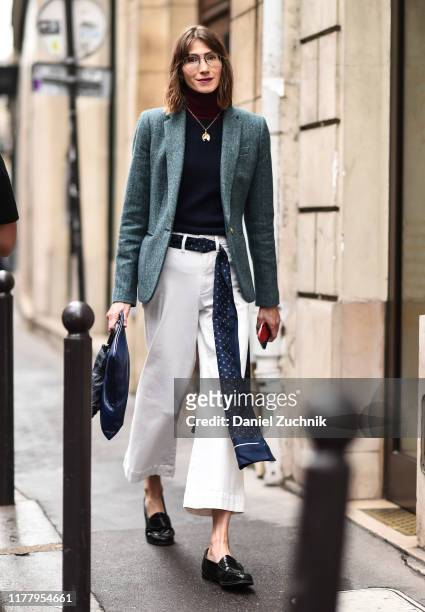 Guest is seen wearing a green jacket, blue sweater, white pants and a Thom Browne belt outside the Thom Browne show during Paris Fashion Week SS20 on...
