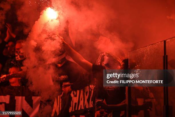 Moenchengladbach fans burn flare bombs during the UEFA Europa League Group J football match AS Roma vs Borussia Moenchengladbach on October 24, 2019...