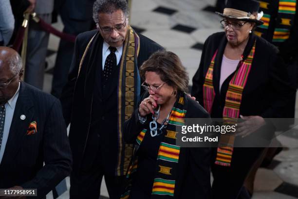 Reps. Robin Kelly, , center, Emanuel Cleaver, , and Alma Adams, pay their respects at the memorial service for the late Rep. Elijah Cummings at the...