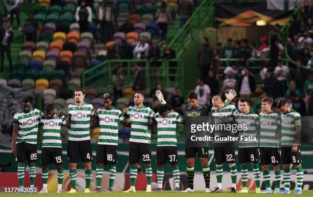 Sporting CP players during a moment of silence in memory of former player Rui Jordao before the start of the UEFA Europa League Group D match between...
