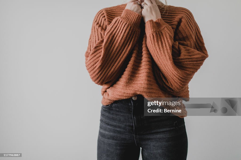 Woman wearing cozy sweater and jeans