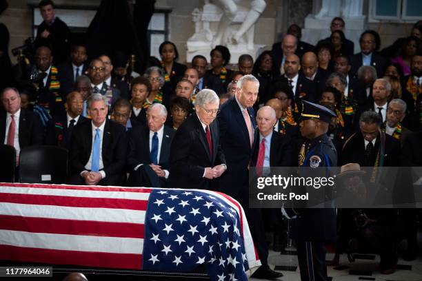 Senate Minority Leader Chuck Schumer and Senate Majority Leader Mitch McConnell rise to pay respects to the late Rep. Elijah Cummings during his...