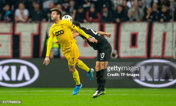 Orlando Sa of Standard Luettich and Makoto Hasebe of Eintracht Frankfurt battle for the ball during the UEFA Europa League group F match between...