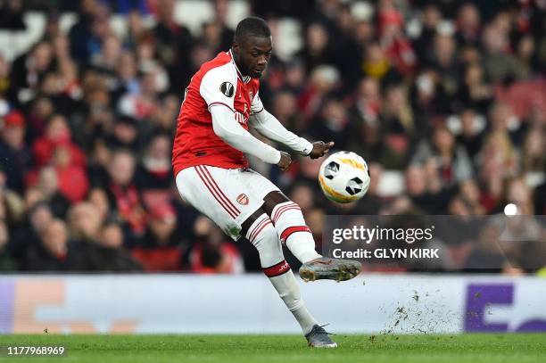 Arsenal's French-born Ivorian midfielder Nicolas Pepe takes a free-kick to scores his team's second goal during their UEFA Europa league Group F...