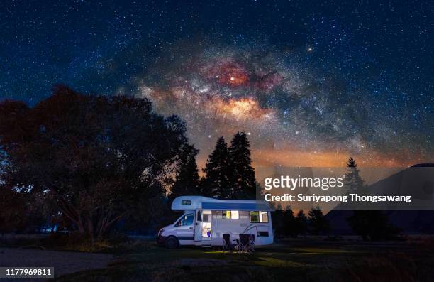 motorhome at free camp site with milky way sky in new zealand. - summer evening stock pictures, royalty-free photos & images