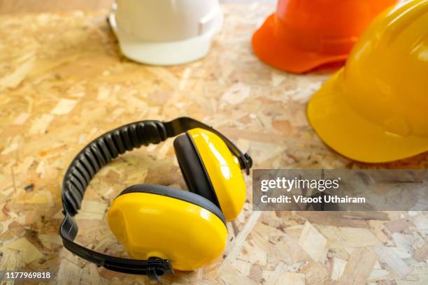 standard construction safety equipment. - construction headphones stock pictures, royalty-free photos & images
