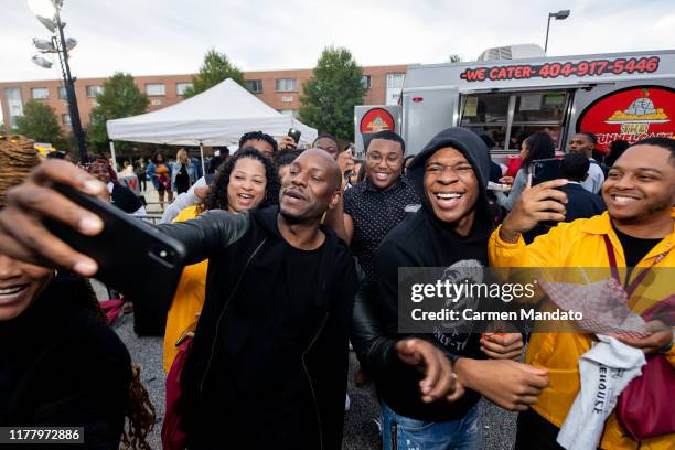 Tyrese Gibson takes a selfie with fans during the "Black & Blue" cast members' visit to Morehouse College on October 24, 2019 in Atlanta, Georgia.